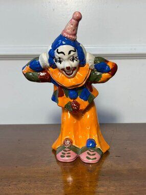 Orange porcelain clown figurine